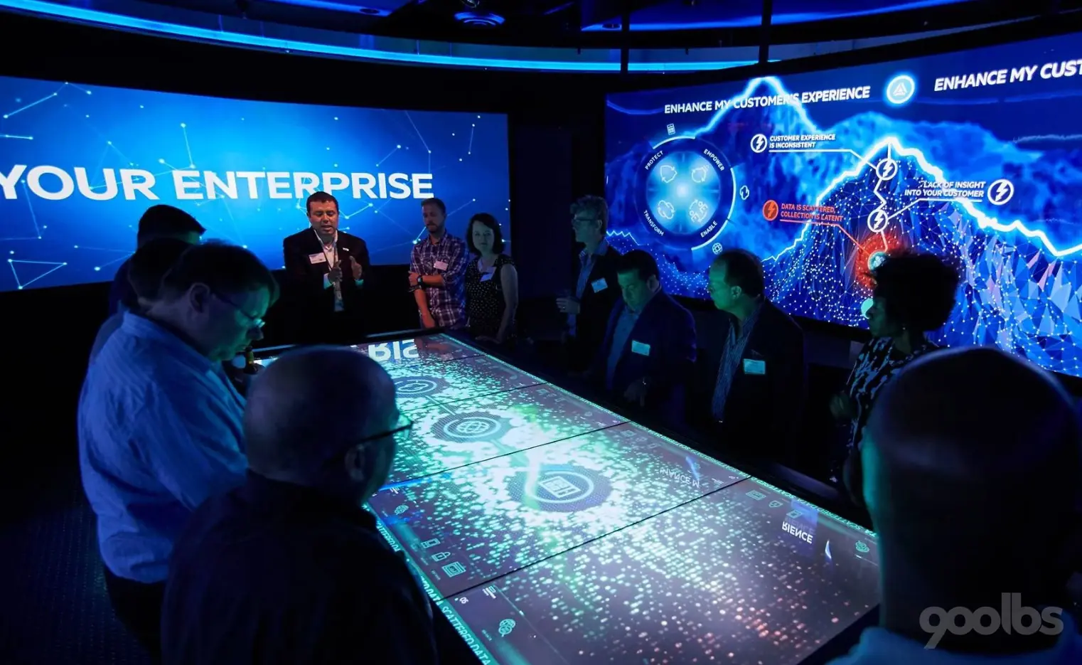 Visitors gathered around an HPE interactive experience