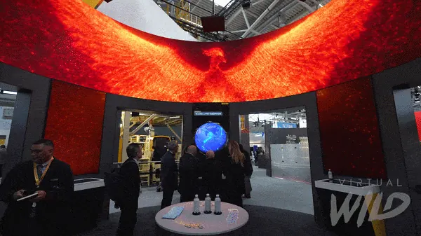 Visitors moving through Husky's immersive phoenix exhibit
