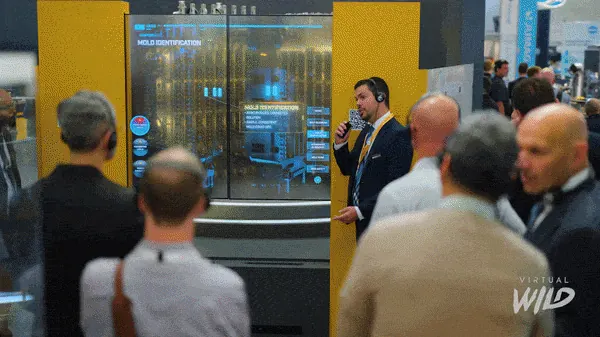 A presenter guiding visitors through an interactive tooling experience